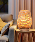 Vintage Dope Gold Industrial Table Lamp With Rustic Metal Cage Shade on side table next to sofa in living room, warm glow