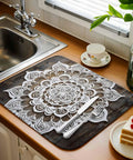 Dish Drying Mat With Abstract Flowers In White For Kitchen Counter Must Have Absorbent Microfiber Surface With Cushioned Drying Layer Machine Washable Vintage Wood Grain Look 16 By 18 Inches on countertop near sink.