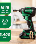 18V MultiVolt Brushless Impact Driver Kit with 2 Batteries displayed on wood surface, showing its compact, lightweight design for tough jobs.
