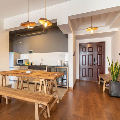 Modern kitchen with wooden tables and benches, lit by Vintage Edison LED Bulbs 6W Equivalent To 60W Warm White 2700K