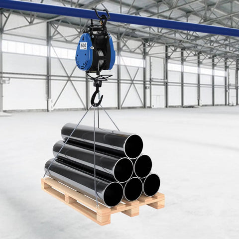 Huge 1100 Lb Electric Winch With Wireless Remote And 98 Foot Cable lifting black pipes from a wooden pallet in a warehouse.
