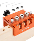 Pro Grade Adjustable Width Dowel Jig For Woodworking With Imperial Scale Centers Slick Precision Drill Guide For Straight Holes Includes 3 Drill Bits And 3 Stop Rings Perfect For Dowels And Biscuit Joinery Projects on a wooden board