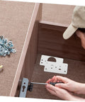 Person installing Stainless Steel Hinge Repair Plate Kit For Cabinets And Furniture Easy Install Quick Fix Hinges, showing parts and tools.