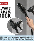 Hand holding 6 Spray SureDock Magnetic Shower Head With Handheld, Matte Black Finish, hose visible on MagnaTite docking.