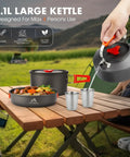 17 Piece Campout Friendly Camping Cookware Kit With Large Pot And Small Kettle Plus 7 Inch Frying Pan on wood table