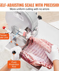 Beast 1500W Stainless Steel Meat Bandsaw For Home Butchering Countertop Bone Saw in use cutting meat with precision scale