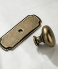 10 Pack 1 1/4 Inch Cabinet Knobs With Matching Backplates Antique Brass Vintage Drawer Pulls close-up of knob and plate