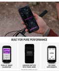 Rider using phone to track data with Rally XC210 Dual Sensing Power Meter Pedals for mountain and gravel riding, SPD compatible.