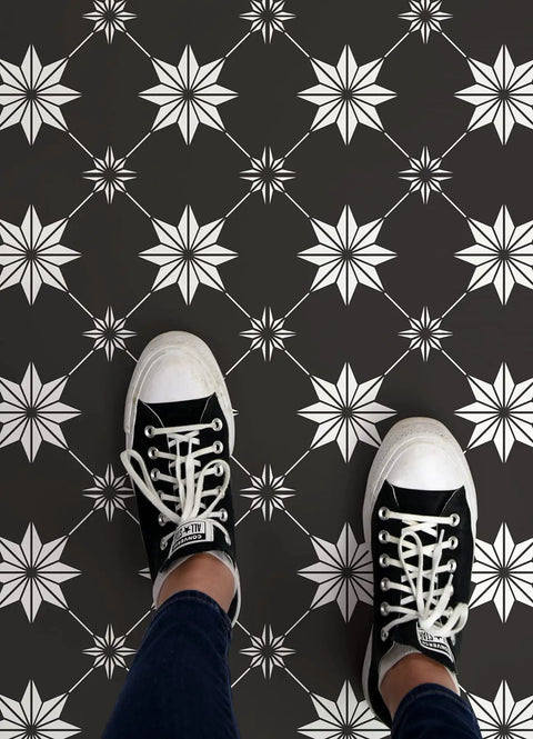 Person standing on Black Rigel Peel And Stick Floor Tiles Durable Vinyl With Easy Install DIY Friendly No Grout Needed