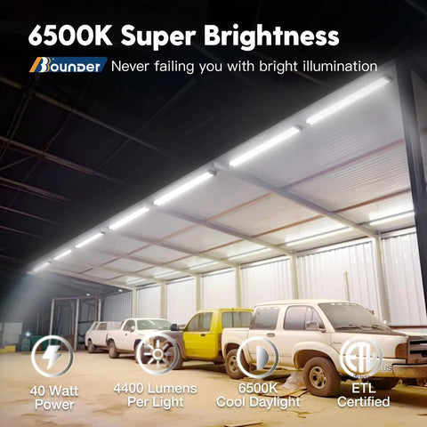 12 Pack Linkable LED Shop Lights With Reflectors, 4 Ft, 4400 Lumens, 6500K Cool Daylight installed in a garage