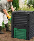 Man using 80 Gallon Large BPA Free Outdoor Compost Bin With Rotating Chamber And Sliding Door For Garden Patio All Season Fast Easy Odor Free Composting Of Kitchen Waste And Yard Scraps
