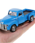 Little Blue Truck Pull Back Toy Car With Opening Door held in hand, vintage alloy mini pickup, retro style for home office decor.