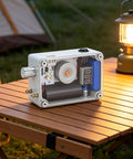 Hand Crank Generator With Adjustable Cob Led Light Portable Usb Charger For Emergency Prep Reliable Survival Power Bank shown on table with camping lamp.