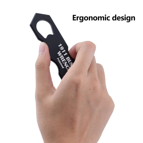 Hand holding Multifunction 1911 Wrench Kit Aluminum Tool For Cleaning And Disassembly with ergonomic design emphasis.