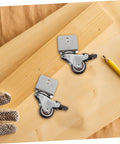 4 Pack Heavy Duty Swivel Casters Rolling Smooth As Silk With Retractable Kickback Locks For Living Room Furniture Workshop Carts And Storage Lockers Rock Solid Setup on wooden surface with measuring pencil.