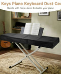 88-key keyboard with Gig-Ready Universal 88-Key Keyboard Dust Cover With Waterproof Leatherette Shell in a studio room.