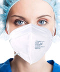 Person wearing Everyday KN95 Face Mask Pack for Adults and Kids With Five Layer Breathable Protection, blue cap visible.