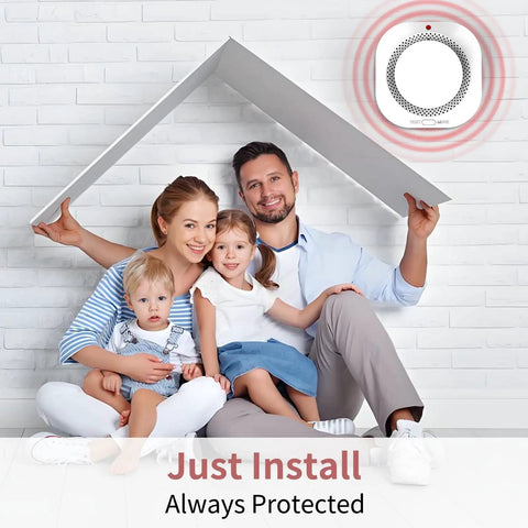 Family sitting under cardboard roof with Wireless Photoelectric Smoke Detectors For Home Use Battery Powered Standalone Alarms displayed.