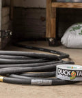 Max Strength Duct Tape For Heavy Duty Fixes Workhorse 1.88 Inch By 45 Yards Weatherproof Silver Tape beside coiled hose