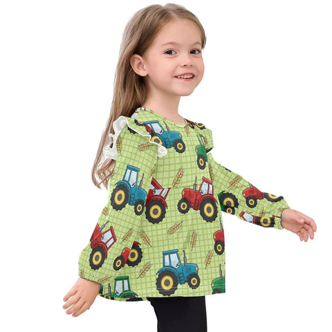 Ultra Soft Cotton Baby Girl Blouse With Ruffled Sleeves Featuring Farm Tractor Print On Green Background For Everyday, Holidays And School, Cozy Long Sleeve Top, Machine Washable, Easy Care 5T worn by a smiling child