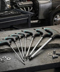 Check Out This Sick T-Type Hex Key Set With 7 Pieces featuring rugged Black Oxide finish for insane leverage on tough bolts, perfect auto repair or DIY furniture tweaks that actually grip tight spots without slipping a single bit. 7-piece T-handle hex keys on workbench