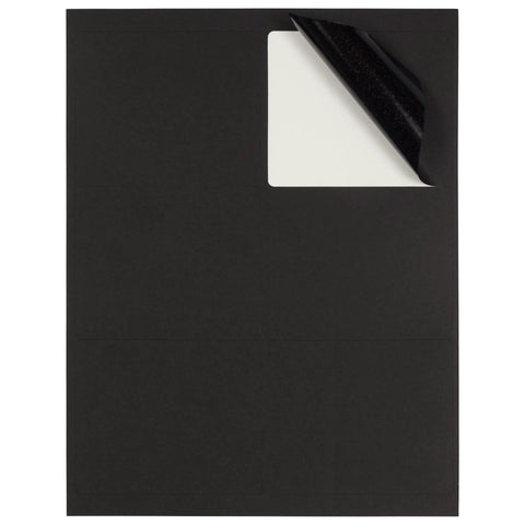 No Fuss Peel And Stick Shipping Address Labels In Sharp Black Large 3.3 By 4 Inches top view showing adhesive backing ready to peel.
