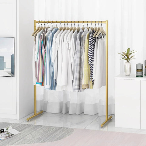 Heavy Duty Free Standing Pipe Clothes Rack With Golden Coat Hanger Durable Drying Rack in a stylish room setting
