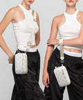 Two models wearing Women's RFID Blocking Crossbody Wristlet Wallet With Four Zippers, Checkered Beige, shown crossbody and wristlet.