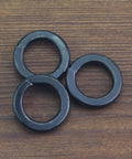 Three 50 Pack 8.8 Grade Alloy Steel M12 Split Lock Washers, Spring Lock Washers For Screws And Bolts on wooden surface