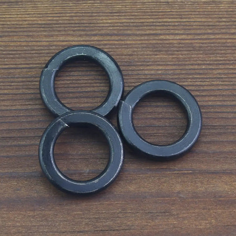 Three 50 Pack 8.8 Grade Alloy Steel M12 Split Lock Washers, Spring Lock Washers For Screws And Bolts on wooden surface