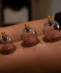 Ultimate Pro Cupping Therapy Set With 18 Multi Sized Vacuum Cups Two Hand Pumps And Detailed Cupping Guide on skin during therapy