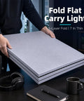 Portable Soundproof Box For Singer And Streamer Ditch Room Static Fast Setup Foldable Acoustic Vocal Booth stacked and held, 7 inches thin.