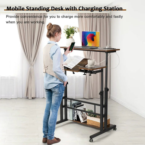 Person using Mobile Standing Desk With Adjustable Height Rolling Desk Stand Up Station For Home Office Portable Laptop Desk On Wheels