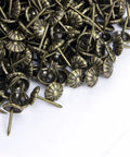 Top Notch Antique Brass Upholstery Tacks Hella Sturdy Daisy Pattern Nails For Diy Furniture Makeover Sweet Home Decor Trim One Hundred Piece Set Seven Sixteenths Inch Thickened Heads, showing decorative fasteners. 100 pack.