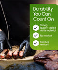 Front view of hands wearing black nitrile gloves slicing meat on a wooden board with a green durability badge overlay