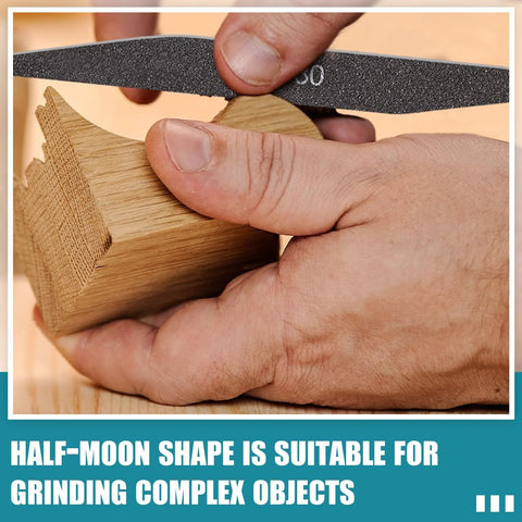 Sanding sticks for model making - close-up of hand using a black grit sanding stick on a wooden block