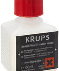 Close-up of XS9000 Liquid Cleaner 100 mL bottle for fully automatic espresso machines with red cap and label text visible