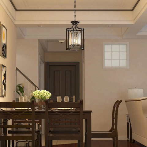 Black Metal Crystal Pendant Light With Adjustable Height hanging over dining room table, modern sleek black finish
