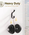 Heavy Duty Wall Mount Coat Hooks Set Of 4, Each Holds Up To 30 Lbs shown holding dumbbell against white wall