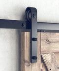 No Fuss Heavy Duty Barn Door Hardware Kit 18 Foot Single Track Sliding System Smooth Ride Glides tough carbon steel frame mounted on wooden door.