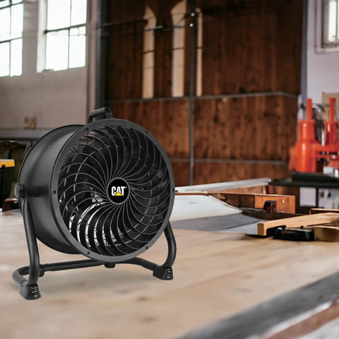 Built Tough 14 Inch Drum Fan Delivers 2300 CFM High Velocity Air For Industrial Spaces with 4 Speed Settings displayed in workshop