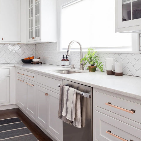 Modern kitchen with 5 Inch 128mm Brushed Antique Copper Cabinet Pulls Handles on white cabinets.