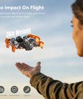 Orange EVA Propeller Guard For DJI Neo 2 Drone With Anti Collision Height Increase Shock Absorbing Ring in flight, hand beneath.