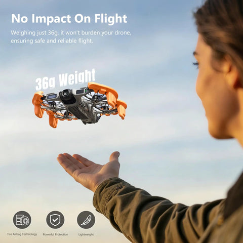 Orange EVA Propeller Guard For DJI Neo 2 Drone With Anti Collision Height Increase Shock Absorbing Ring in flight, hand beneath.