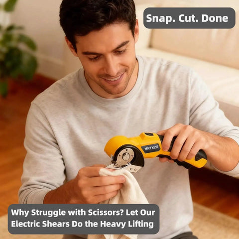 Cordless Electric Scissors With Led Light And Safety Lock Cuts Cardboard Fabric Carpet Plastic And Leather Without One Bit Of Drama used by a man cutting fabric.