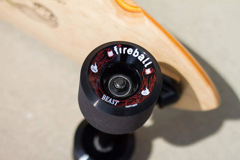 Close-up of a skateboard wheel with 'fireball' branding, showcasing robust design ideal for Dragon Roller Skate Bearings 16 Pack Ultra Smooth Endure Pre Lubed All Weather High Performance Inline Skate Bearings For Rollerblades With Lifetime Guarantee.