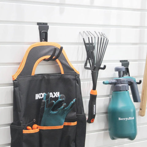 Eight Pack Slatwall Hooks Heavy Duty Garage Organizer For Power Tools And Cords Fits Standard 3 Inch Slat Wall Holds Up To 70 Lbs Durable Wall Hangers For Tool Storage And Cord Management In The Garage Goes Hard For Your Garage in use with garden tools and accessories on white slatwall.