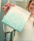 Person holding Ultra Absorbent Mats 10 Pack Dual Sided Absorption Gel Conversion Locks In Liquids Quickly 6.75x16.5 Inches