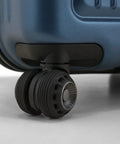 Close-up of wheels on 26 inch polycarbonate spinner luggage in matte navy, showing durability and ease of movement.