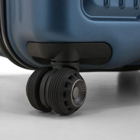 Close-up of wheels on 26 inch polycarbonate spinner luggage in matte navy, showing durability and ease of movement.